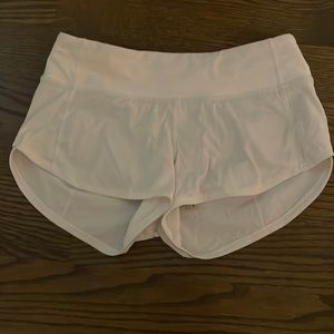 White lululemon 2.5 inseams size 2 speed up shorts.